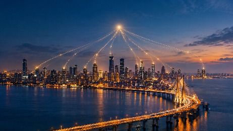 Mumbai skyline and sea link at dusk with glowing lines of light rising from the towers